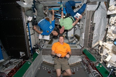 NASA astronauts Terry Virts (bottom), STS-130 pilot; Stephen Robinson (top right), STS-130 mission specialist; and Japan Aerospace Exploration Agency (JAXA) astronaut Soichi Noguchi, Expedition 22 flight engineer, are pictured in the newly-installed Node-3 of the International Space Station while space shuttle Endeavour remains docked with the station. (NASA image S130-E-007783, 14 February 2010) 
