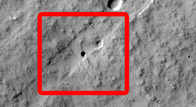 Sixteen seventh-grade students at Evergreen Middle School in Cottonwood, Calif., found the Martian pit feature at the center of the superimposed red square in this image while participating in a program that enables students to use the camera on NASA's Mars Odyssey orbiter. Image Credit: NASA/JPL-Caltech/ASU
